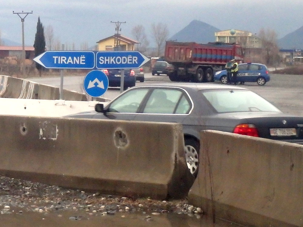 Tiranë/Shkodër road sign at rural roundabout
