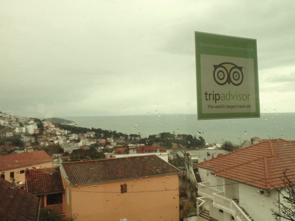 The window in our room, with the sea and a Tripadvisor sticker