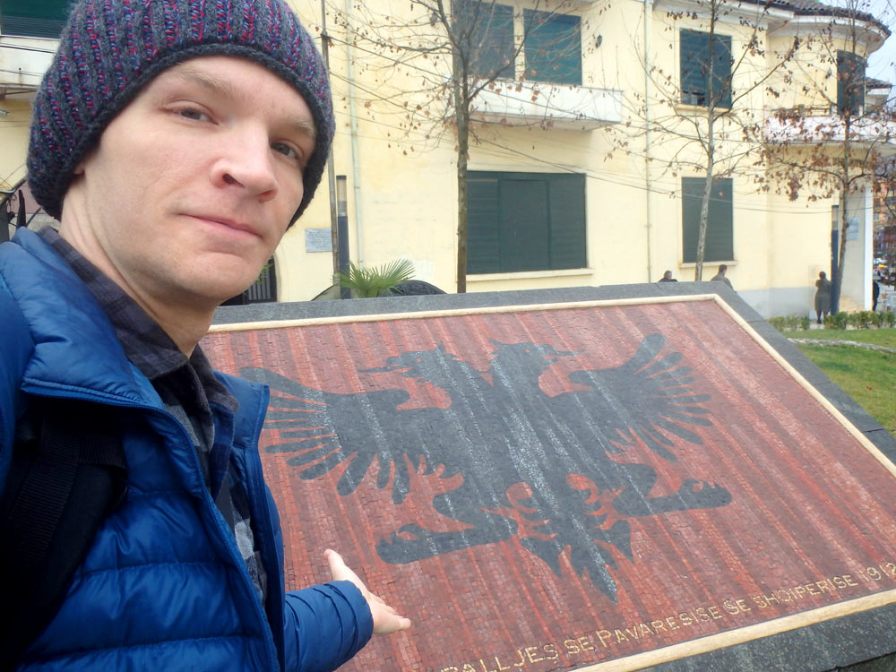 With a mosaic of the Albanian flag along Rruga George W. Bush