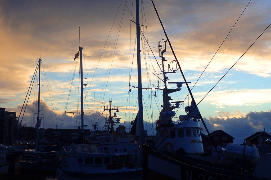 Ships' masts as the sun sets.