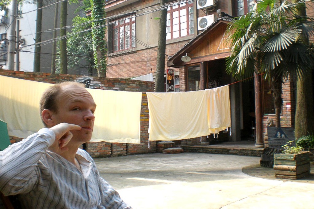 Dr. Evil impression outside the hostel in Wuhan.