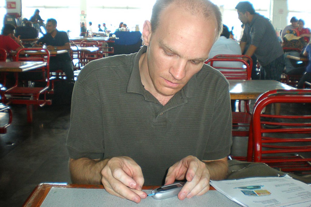 jeremy-checking-blood-sugar-mexico-city-bus-station