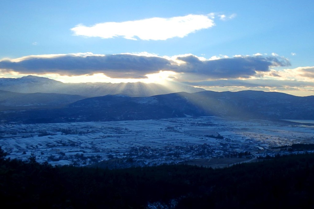 sun-behind-cloud-snow-mountain-central-croatia