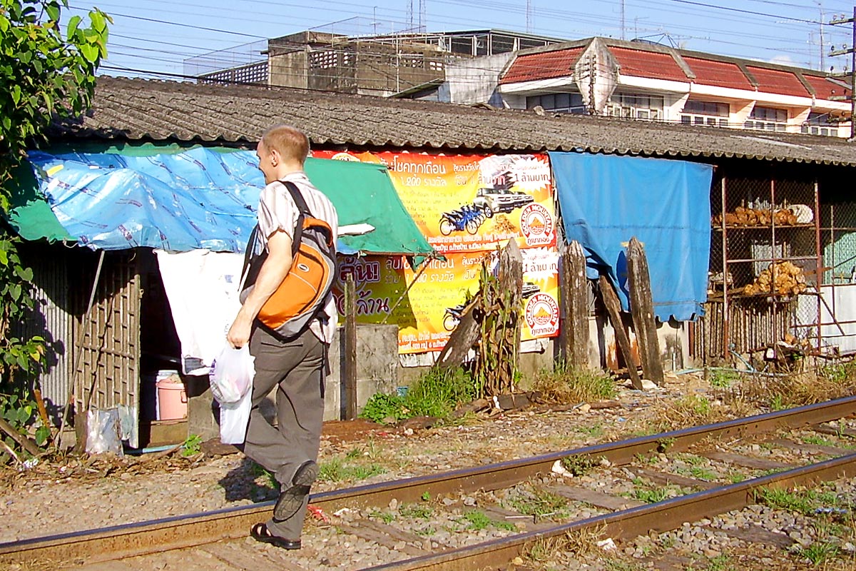 jeremy-walking-on-train-tracks-trang-thailand