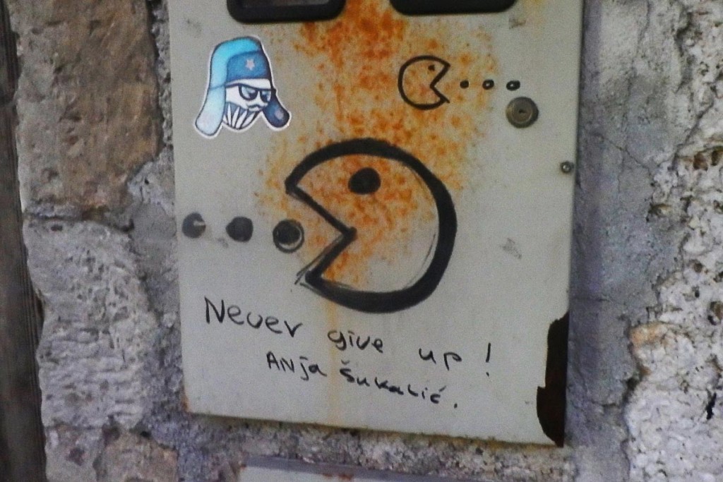 Inspirational Pac-Man graffiti in English, Mostar.