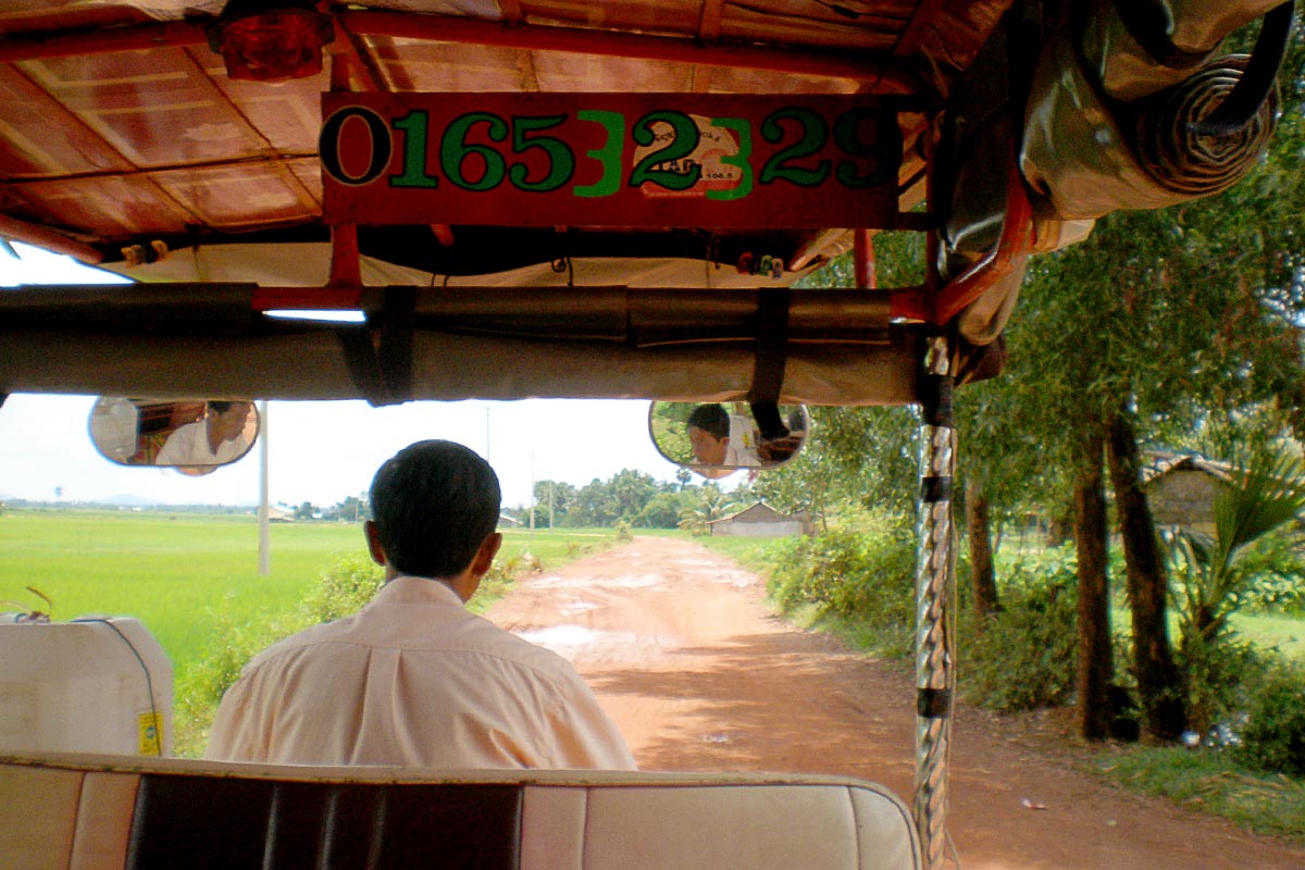 view-dusty-road-from-tuktuk-rural-cambodia