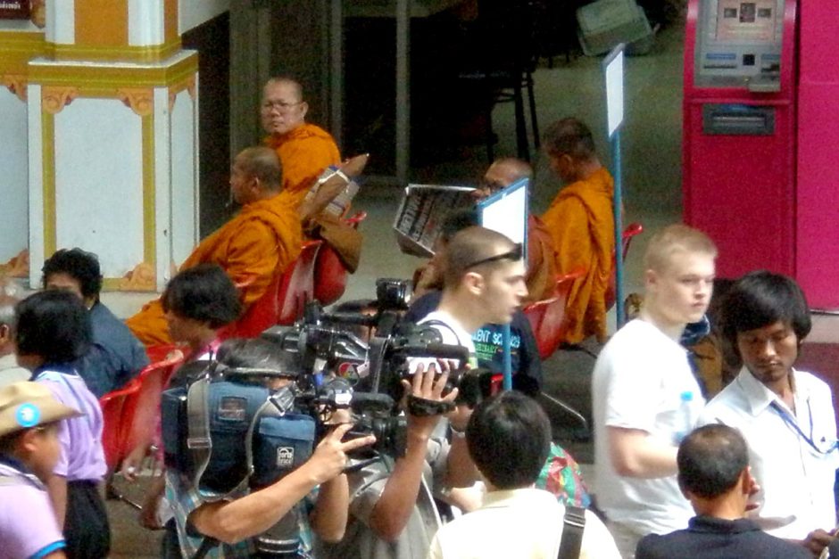 A typically varied scene in Bangkok's busy train station.