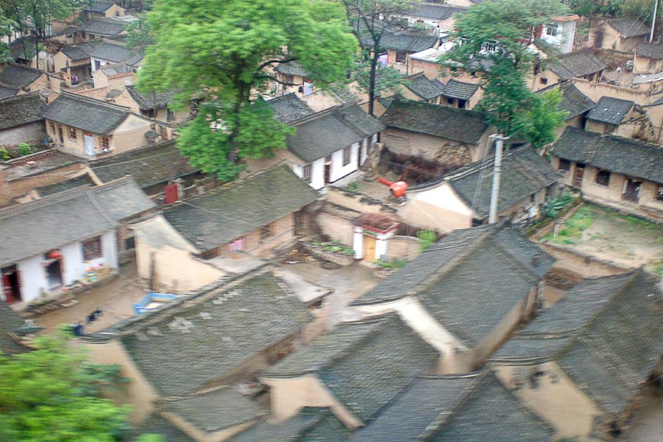 The villages we passed looked like this – tiny, muddy, and without electricity. All I have is this blurry photo taken from the train, but I wonder what it's like to visit one of these places...?