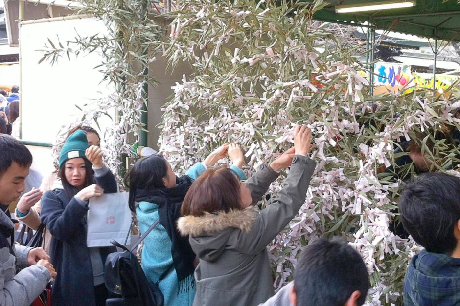 Tying prayers to trees on New Year's Day.