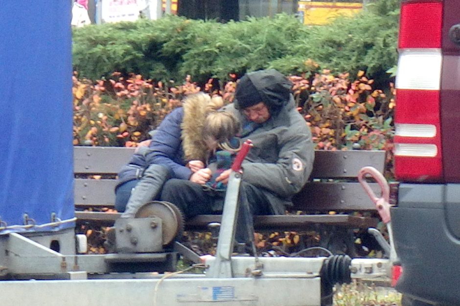 couple-passed-out-bench-warsaw-poland-centralna