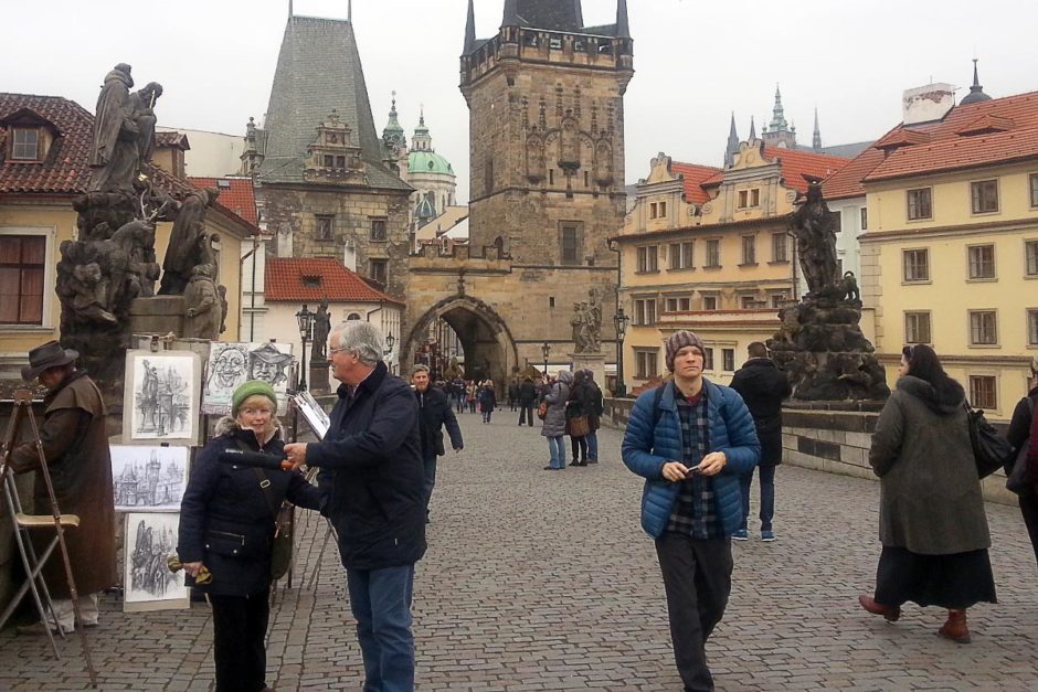 jeremy-walking-on-charles-bridge-prague-camera