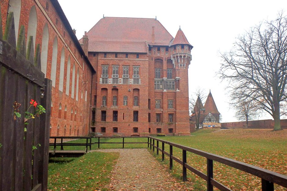 malbork-castle-wall-bridge-tree-cloudy-sky