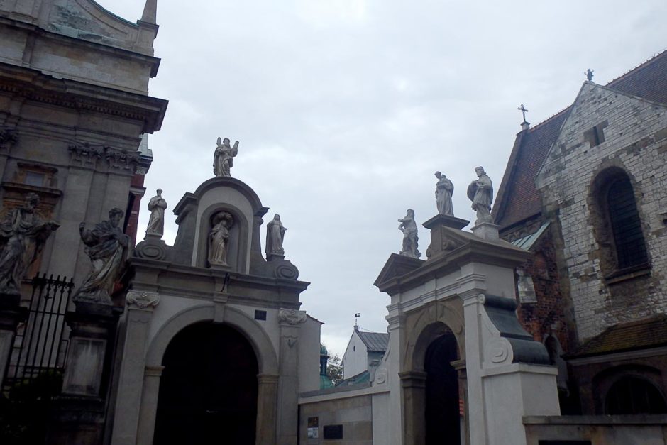 statues-on-rooftops-krakow-poland-cloudy