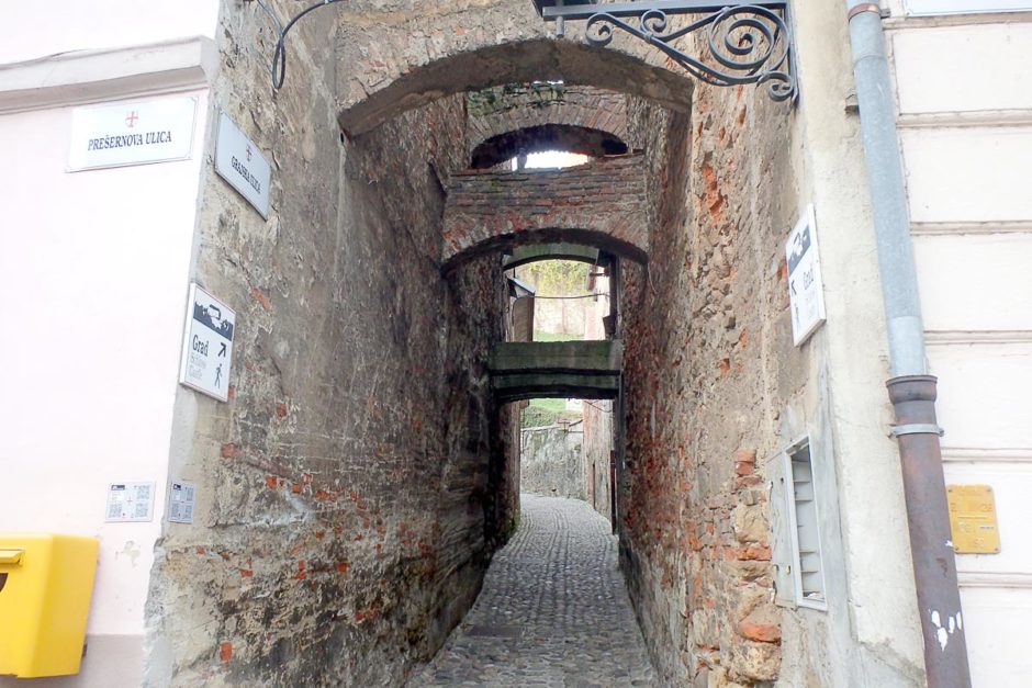 ancient-brick-arch-walkway-alley-ptuj-slovenia