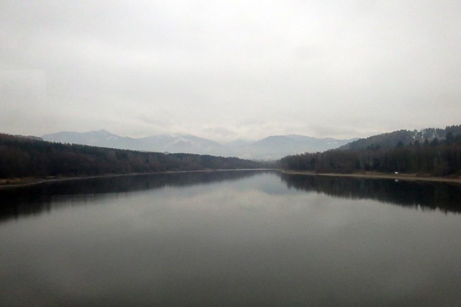 river-cloudy-mountains-slovakia-train