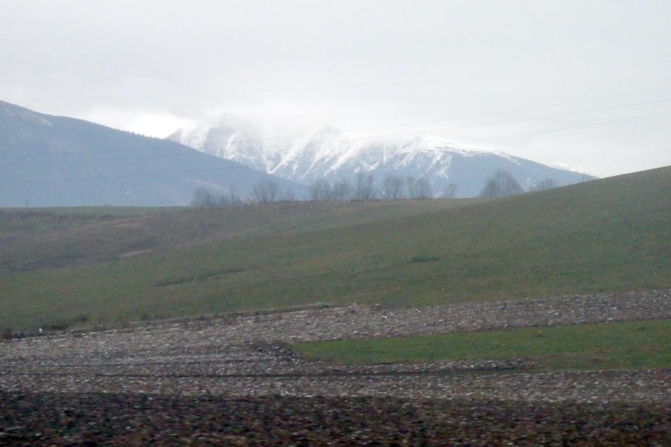 snowy-mountain-green-field-slovakian-train