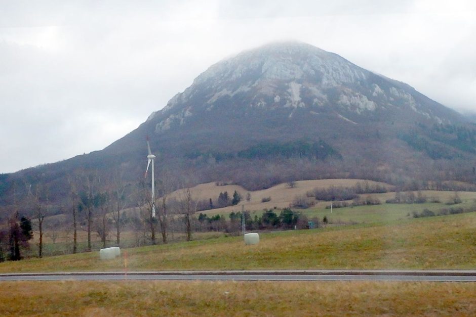 windmill-grassy-hill-bus-window-west-slovenia