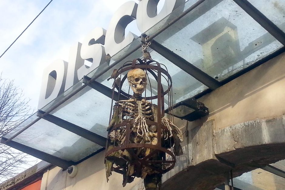 disco-bar-ljubljana-skeleton-in-cage-sign
